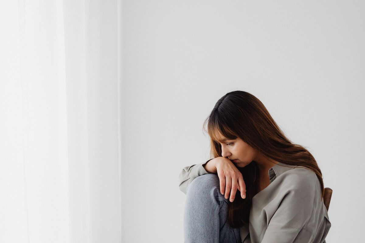 A woman in quiet thought — the internal world of anxious attachment