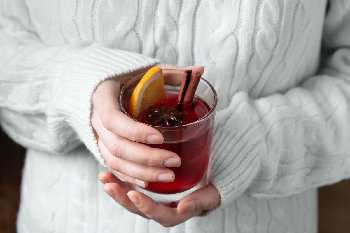 Two hands holding a warm cup — a small act of self-attention