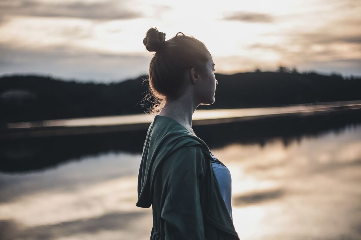 Woman in quiet reflection — asking herself the honest questions about love and comfort