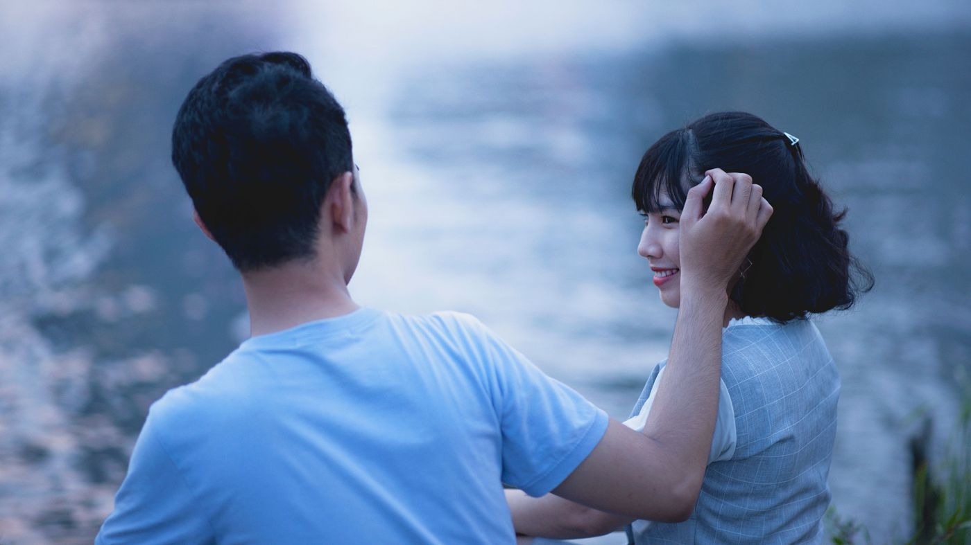 Two people sitting quietly together, relaxed and at ease