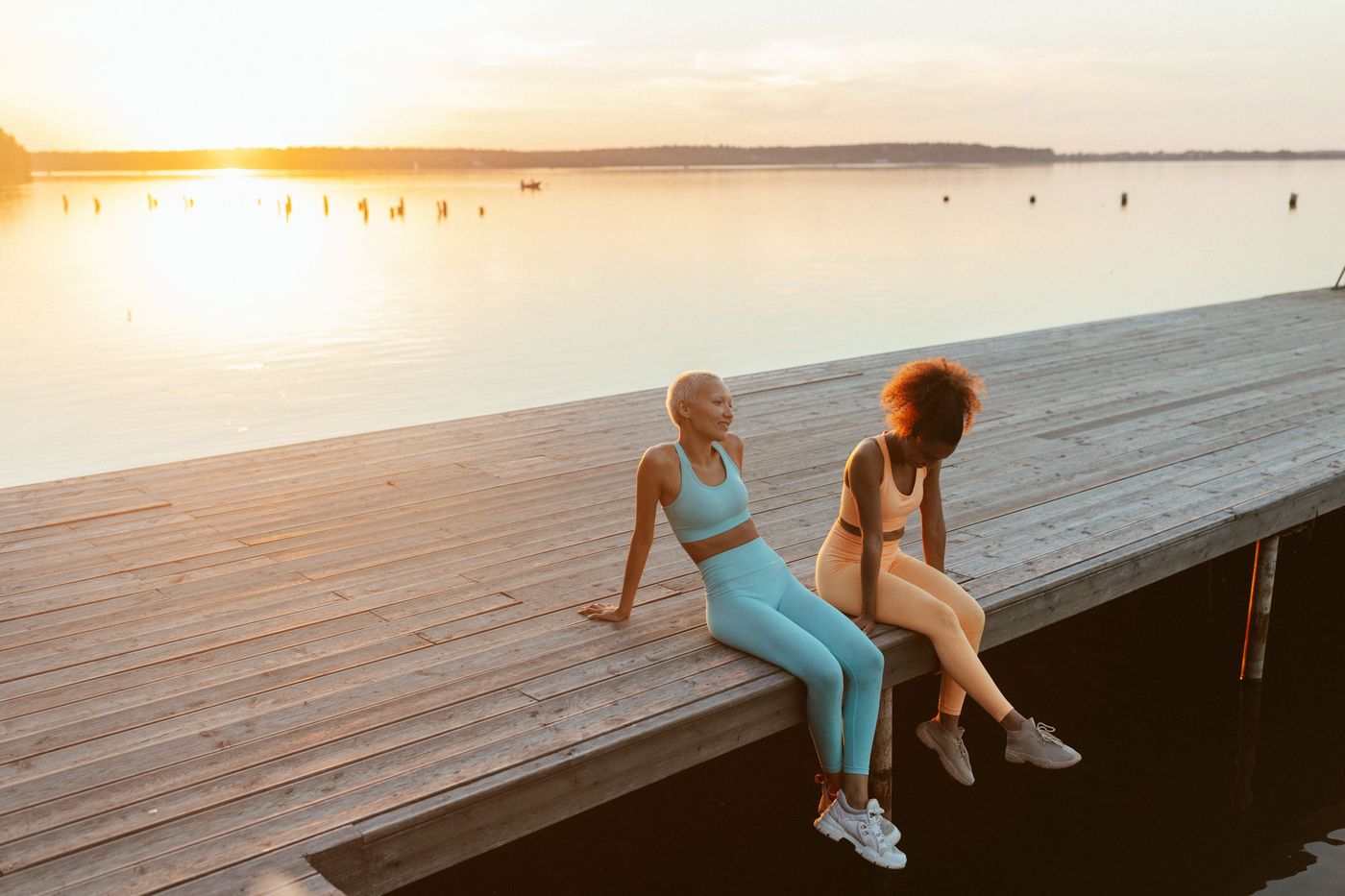 Two friends laughing together — the ease of a real friendship