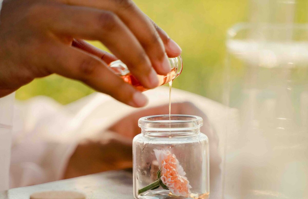 Clean fragrance bottle on a windowsill in soft natural light