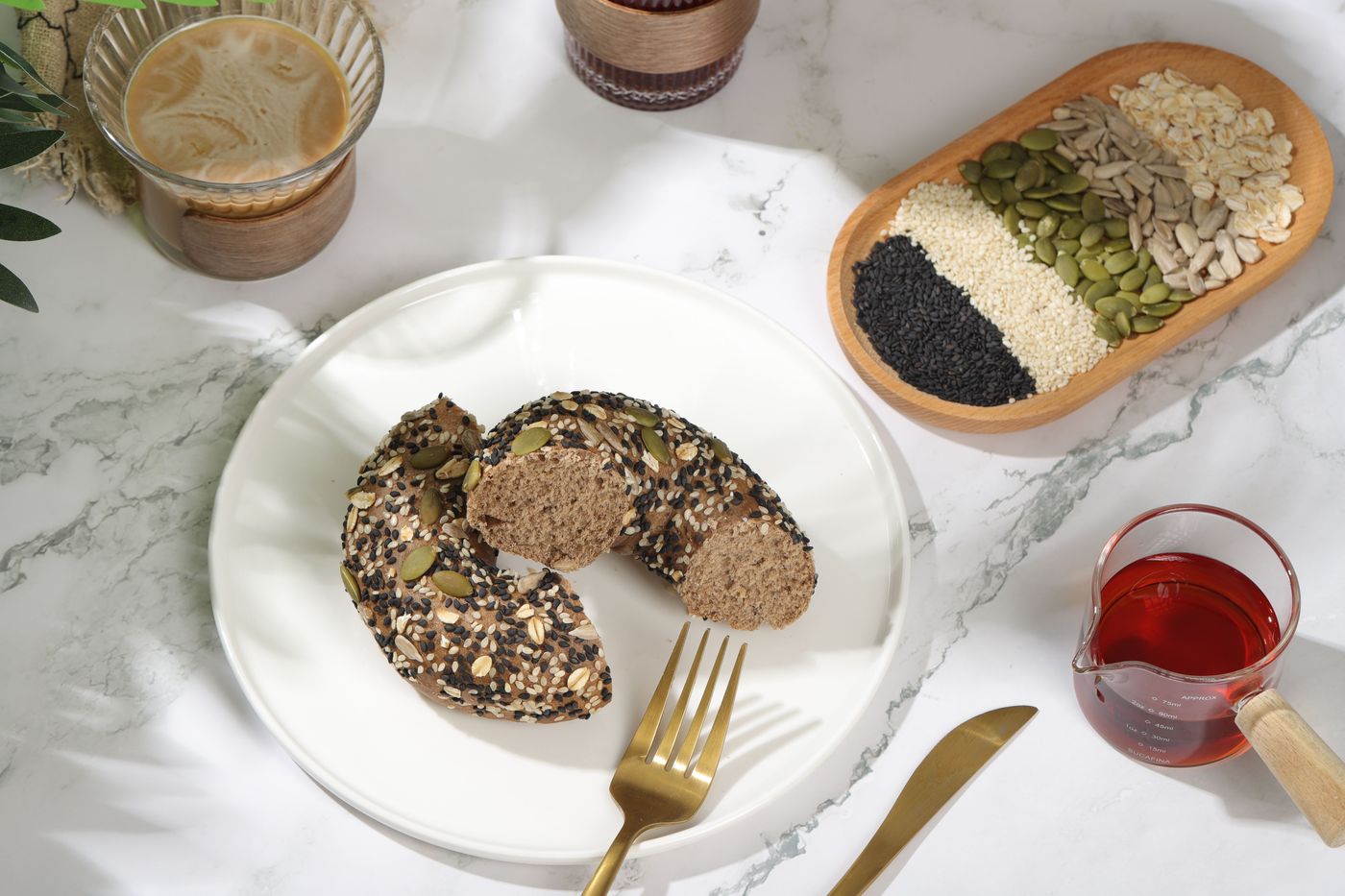 Flax, pumpkin, sesame and sunflower seeds in small bowls on a wooden surface