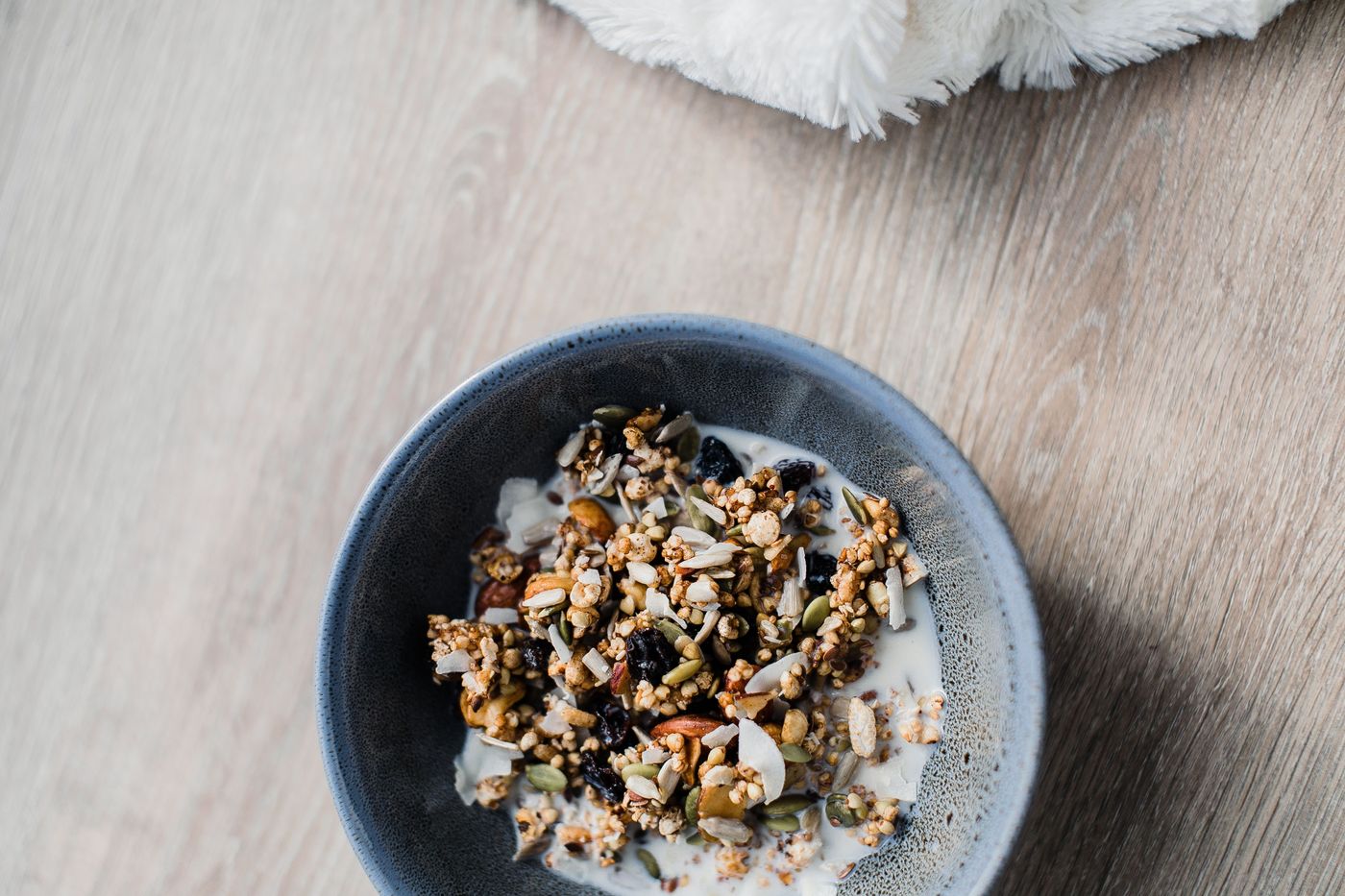 Ground seeds stirred into a bowl of yogurt and oats