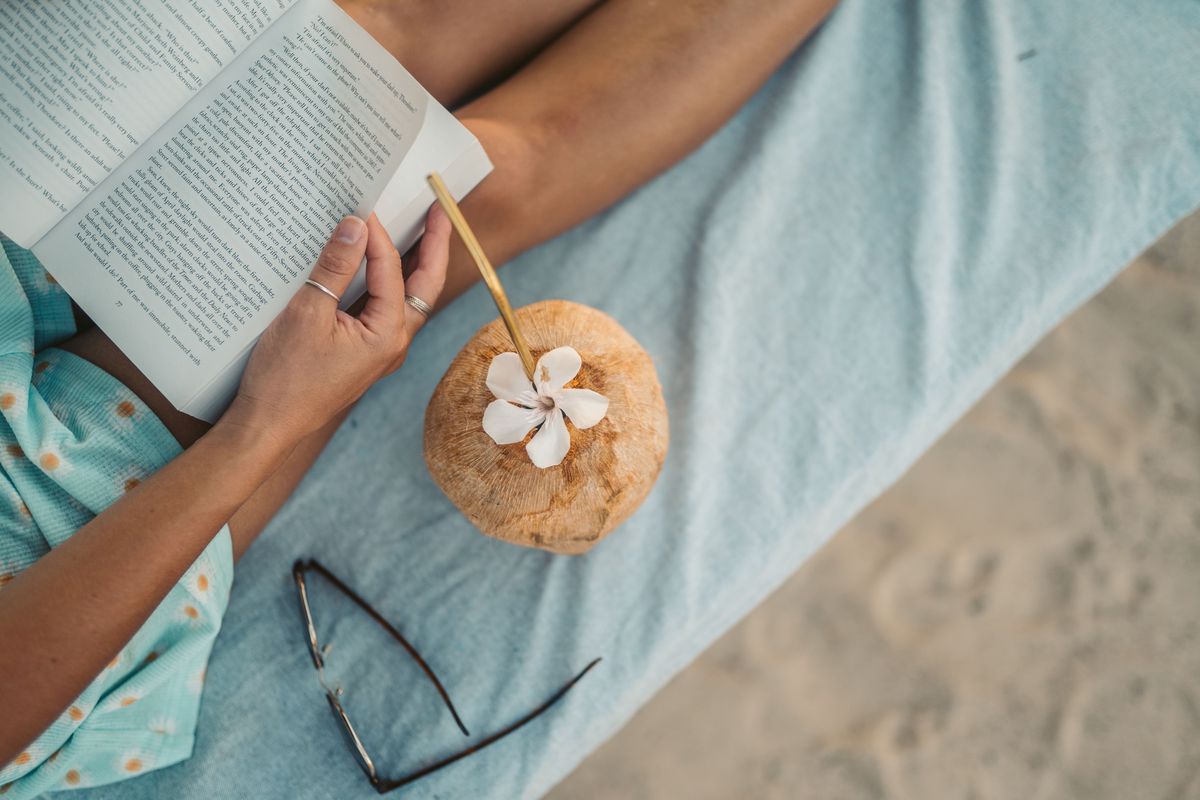 A cozy, softly lit evening at home with tea and a book, phone put away