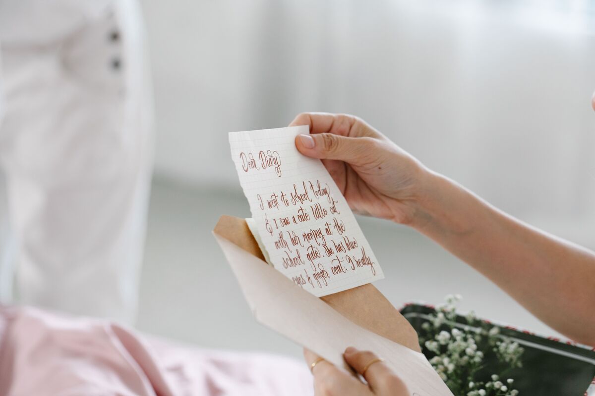 A stack of handwritten letters and cards tied with string